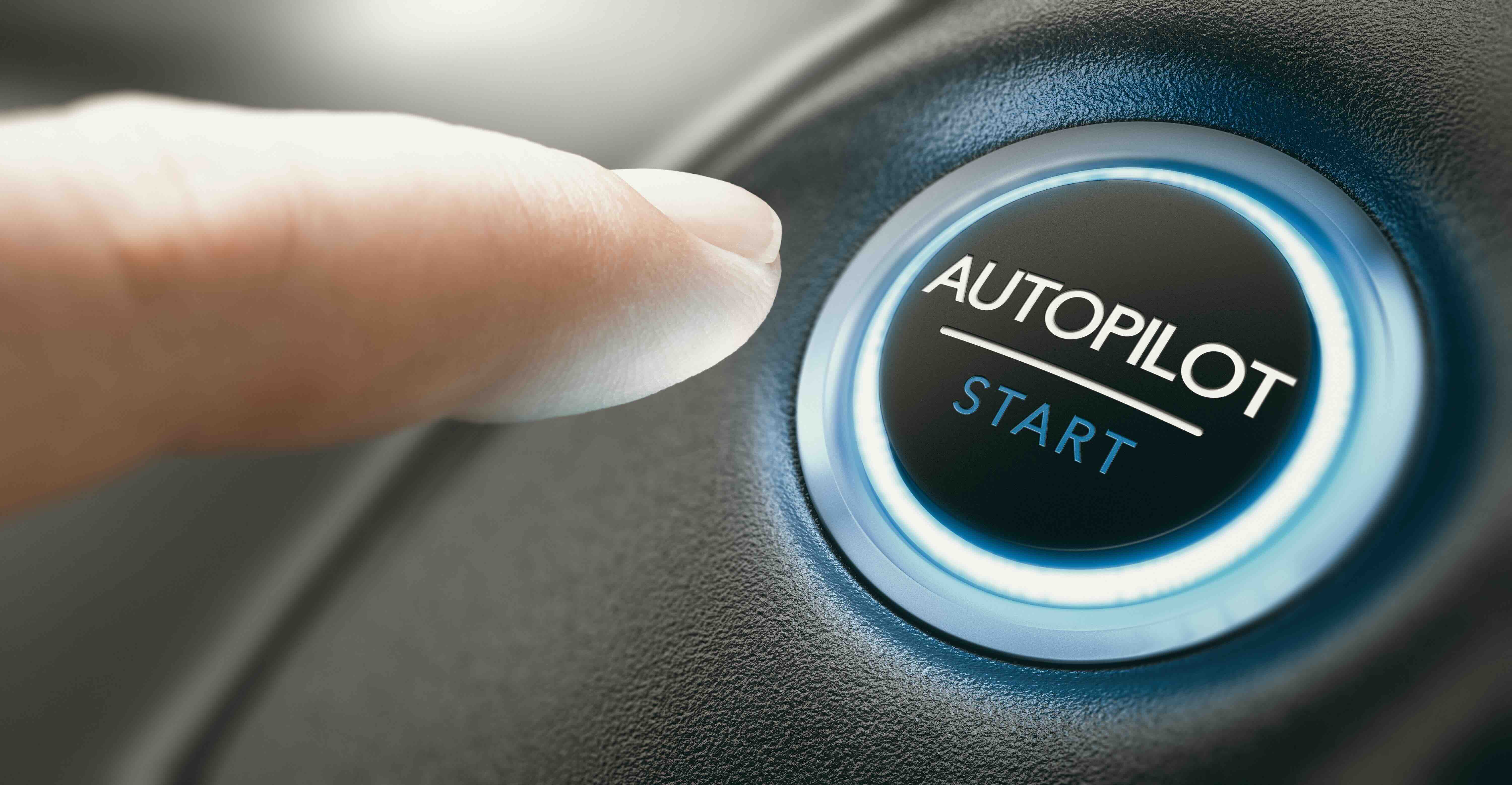 autopilot button, with finger about to press it